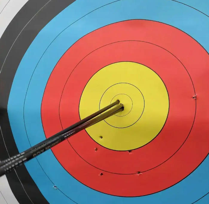target face with tight cluster of carbon arrow